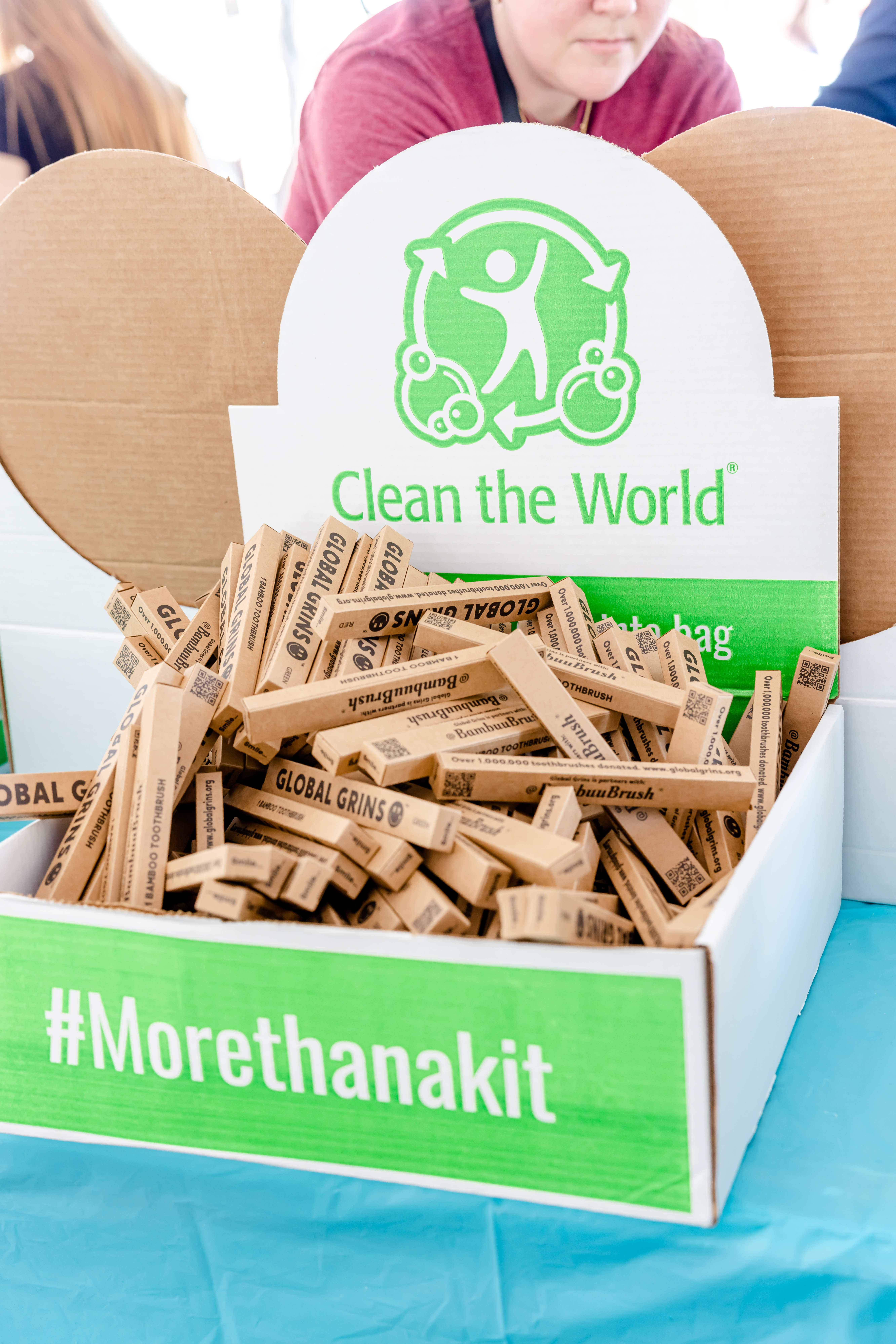 Close up of Clean the World supply box with small individual boxes of toothbrushes.